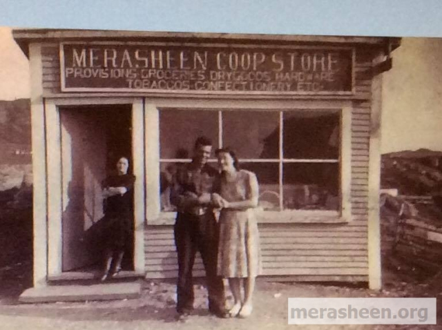 Taken in 1946, this building is the third to hold the Co-op store in Merasheen and was built in 1941. At a board meeting in January 1941, the possibility of building a new store as well as the amount of material required to do so was discussed. It was decided to give each member a slip outlining the amount of sticks each was expected to give. The size of the building was to be 14x24. In February 1941, the site was chosen and at the next meeting in March, Mr. Austin Pomroy was appointed foreman to build the new store. It opened later that year.&amp;nbsp; The lady in the doorway is Helen Fleming, sister of Fr. John Fleming who married Pat Canning.&amp;nbsp; The couple is most likely a young John and Lizzie Ennis.