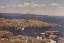24 Taken from the Big Hill around 1964. Out towards Pitcher's Point you can see Mike Ennis' house and Ron Pitcher's house. At the bottom left is Paddy Ennis' house, Hennessey's house, George Wilson's stage at the Fender and Johnny Wilson's house.
